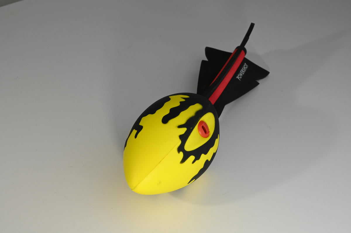 Javelin ball with integrated whistles